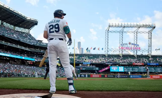 Seattle Mariners' Cal Raleigh prepares to bat against the Baltimore Orioles during the first inning after his return from the injured list in a baseball game, Tuesday, June 16, 2026, in Seattle. (AP Photo/John Froschauer)