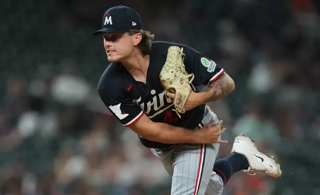 Minnesota Twins pitcher Travis Adams throws against the Detroit Tigers during the sixth inning of a baseball game Wednesday, June 10, 2026, in Detroit. (AP Photo/Paul Sancya)