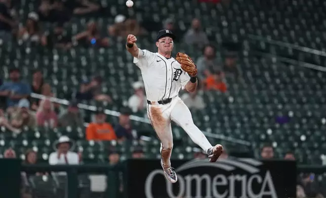 Detroit Tigers third baseman Kevin McGonigle throws to first base to complete a double play on a Minnesota Twins' Byron Buxton ground ball during the eighth inning of a baseball game Wednesday, June 10, 2026, in Detroit. (AP Photo/Paul Sancya)
