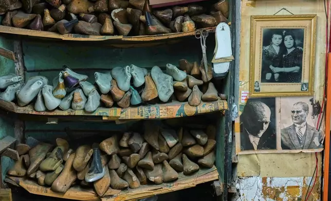 Shoe molds are stacked at dance shoe maker Ercan Umay's workshop in Istanbul, Turkey, Tuesday, Jan. 20, 2026. (AP Photo/Francisco Seco)
