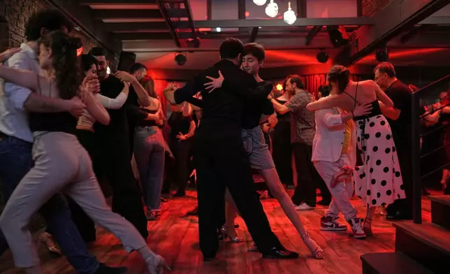 Tango enthusiasts dance during a milonga evening session at La Cumparsita in Istanbul, Turkey, Tuesday, Jan. 27, 2026. (AP Photo/Francisco Seco)