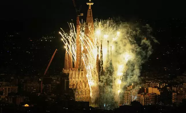 Fireworks engulf Antoni Gaudí's Basilica of the Sagrada Família, seen from Torre Glòries, after Pope Leo XIV blessed the newly completed central Tower of Jesus Christ in Barcelona, Spain, Wednesday, June 10, 2026. The tower's completion made the Sagrada Família, at 172.5 meters (566 feet), the tallest church in the world. (AP Photo/Fatima Shbair)