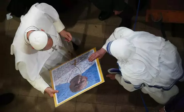 Pope Leo XIV leaves at the end of a meeting with faithful and members of the diocesan charity and welfare organizations in the Church of Sant Agusti in Barcelona, Spain, Wednesday, June 10, 2026 (AP Photo/Alessandra Tarantino)