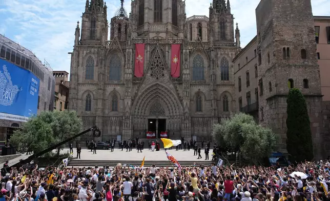 Pope Leo XIV looks at the cheering crowd upon arriving to attend a midday prayer at the Cathedral of the Holy Cross and Saint Eulalia in Barcelona, Spain, Tuesday, June 9, 2026. (AP Photo/Emilio Morenatti)
