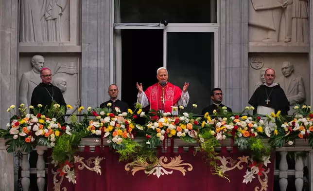 Pope Leo XIV greets the faithful from the balcony after leading a rosary at the Abbey of Our Lady of Montserrat, in Montserrat, Spain, Wednesday, June 10, 2026. (AP Photo/Joan Mateu Parra)