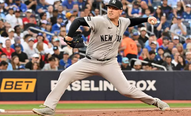 New York Yankees pitcher Ryan Weathers (40) throws to a Toronto Blue Jays batter during first inning of a baseball game in Toronto on Friday, June 12, 2026. (Jon Blacker/The Canadian Press via AP)