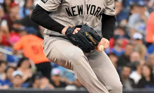 New York Yankees pitcher Ryan Weathers throws to a Toronto Blue Jays batter during the first inning of a baseball game in Toronto, Friday, June 12, 2026. (Jon Blacker/The Canadian Press via AP)