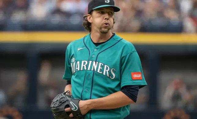 Seattle Mariners starting pitcher Logan Gilbert pauses before delivering against the Cleveland Guardians during the first inning of a baseball game, Saturday, June 27, 2026, in Cleveland. (AP Photo/Phil Long)