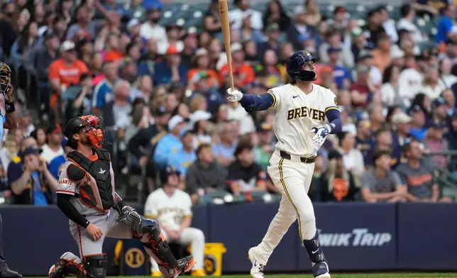Milwaukee Brewers' Brice Turang watches his two-run triple during the second inning of a baseball game against the San Francisco Giants, Monday, June 1, 2026, in Milwaukee. (AP Photo/Aaron Gash)