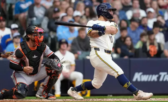 Milwaukee Brewers' Sal Frelick hits an RBI double during the second inning of a baseball game against the San Francisco Giants, Monday, June 1, 2026, in Milwaukee. (AP Photo/Aaron Gash)