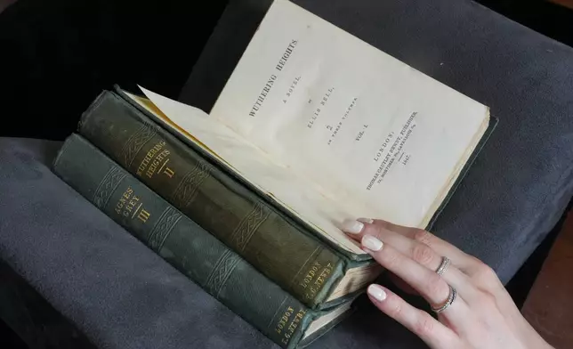 A first edition of Emily Bronte's Wuthering Heights, is on display for sale at Christie's auction house, with copies estimated at 400,000–600,000 GBP (540,000–810,000 USD) in London, Monday, June 15, 2026. (AP Photo/Kin Cheung)