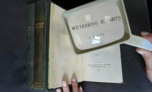 A first edition of Emily Bronte's Wuthering Heights, is on display for sale at Christie's auction house, with copies estimated at 400,000–600,000 GBP (540,000–810,000 USD) in London, Monday, June 15, 2026. (AP Photo/Kin Cheung)
