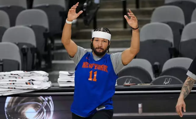 New York Knicks guard Jalen Brunson stretches during a workout prior to the start of the NBA Finals basketball series against the San Antonio Spurs, Tuesday, June 2, 2026, in San Antonio. (AP Photo/Eric Gay)