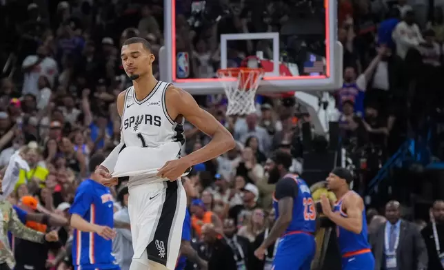 San Antonio Spurs forward Victor Wembanyama walks off the court as time expires during the second half of Game 2 of the NBA Finals basketball series against the New York Knicks, Friday, June 5, 2026, in San Antonio. (AP Photo/Eric Gay)