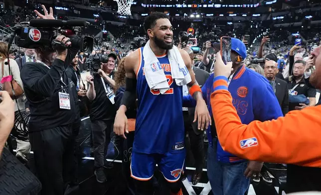 New York Knicks center Karl-Anthony Towns leaves the court after Game 2 of the NBA Finals basketball series against the San Antonio Spurs, Friday, June 5, 2026, in San Antonio. (AP Photo/Eric Gay)
