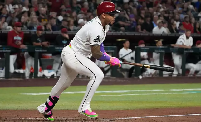 Arizona Diamondbacks' Ketel Marte hits a single against the Los Angeles Angels in the first inning of a baseball game, Tuesday, June 16, 2026, in Phoenix. (AP Photo/Rick Scuteri)