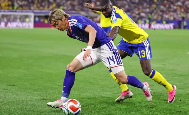 Japan's Junya Ito (14) and Sweden's Ken Sema (13) battle for the ball during the World Cup Group F soccer match between Japan and Sweden in Arlington, Texas, near Dallas, Thursday, June 25, 2026. (AP Photo/Sam Hodde)