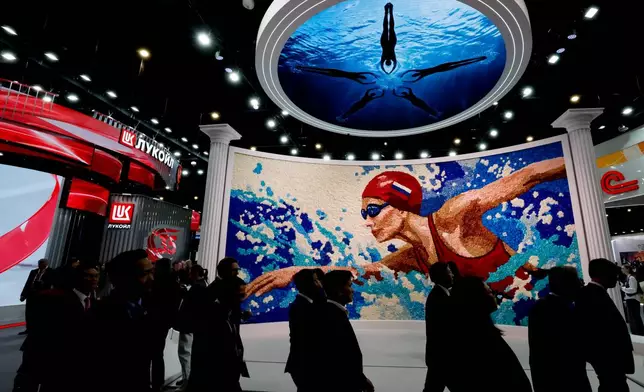 People visit an exhibition at the St. Petersburg International Economic Forum in St.Petersburg, Russia, on Thursday, June 4, 2026. (Anatoly Maltsev/Pool Photo via AP)