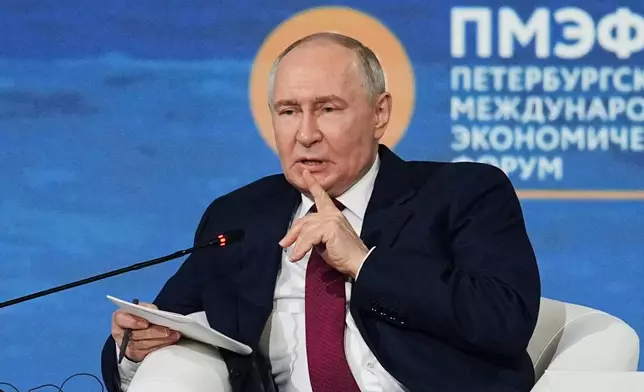 Russian President Vladimir Putin gestures speaking at a plenary session at the St. Petersburg International Economic Forum in St. Petersburg, Russia, on Friday, June 5, 2026. (AP Photo/Dmitri Lovetsky)