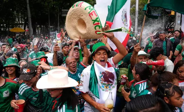 FILE - Soccer fans get revved up at a watch party for the World Cup match between Mexico and Czechia on Reforma Ave., near the Angel of Independence monument in Mexico City, June 24, 2026. (AP Photo/Marco Ugarte, File)
