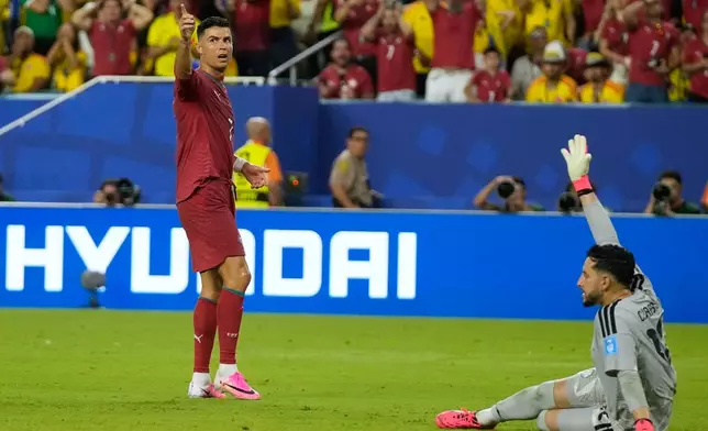 Portugal's Cristiano Ronaldo (7) reacts after missing a chance during the World Cup Group K soccer match between Colombia and Portugal in Miami Gardens, Fla., Saturday, June 27, 2026. (AP Photo/Lynne Sladky)