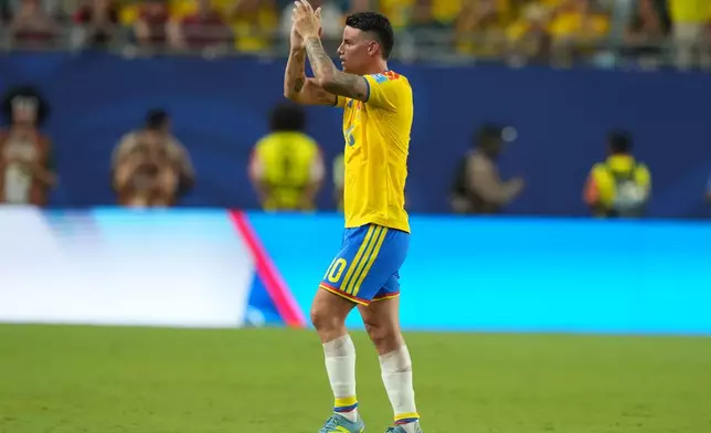 Colombia's James Rodriguez (10) applauds as he leaves the pitch after being substituted during the World Cup Group K soccer match between Colombia and Portugal in Miami Gardens, Fla., Saturday, June 27, 2026. (AP Photo/Lynne Sladky)