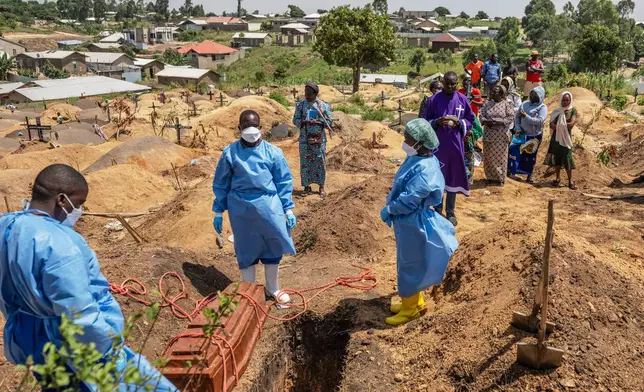 Red Cross workers prepare to bury Vanisa Anifa, a 6-month-old orphaned girl who died of Ebola, at the Bigo Cemetery, in Bunia, Congo, Friday, June 19, 2026. (AP Photo/Moses Sawasawa)