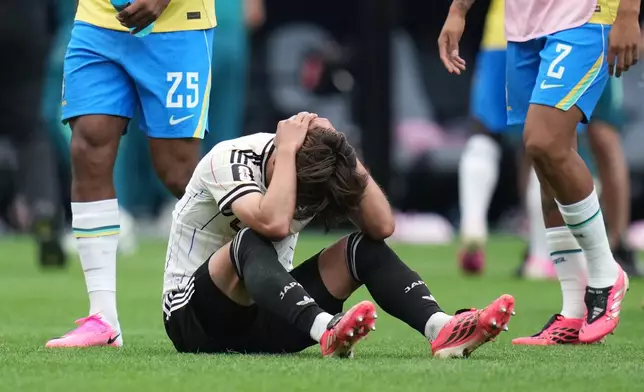 Japan's Kaishu Sano (24) reacts after the World Cup round of 32 soccer match between Brazil and Japan in Houston, Monday, June 29, 2026. (AP Photo/Karen Warren)