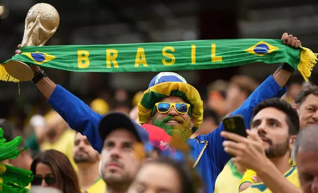 Brazil's fans pose before the World Cup round of 32 soccer match between Brazil and Japan in Houston, on Monday, June 29, 2026. (AP Photo/Eric Gay)