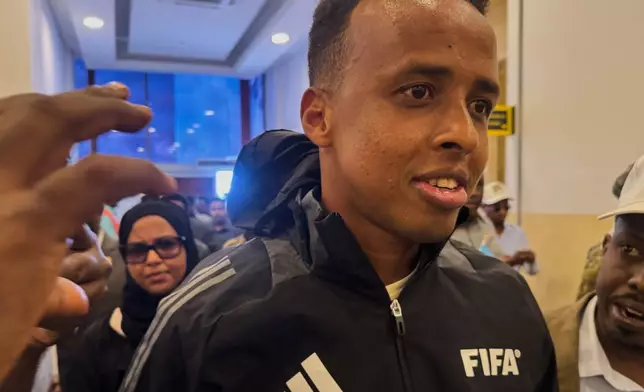 Referee Omar Artan, who was denied entry to the United States, arrives in Mogadishu, Somalia, Wednesday, June 10, 2026. (AP Photo/Farah Abdi Warsameh)