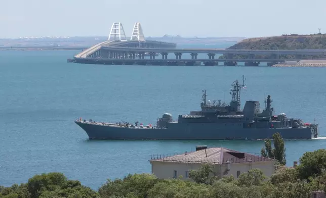 FILE - A Russian military ship transports cars and people from the Russian mainland to the Crimean Peninsula over the Kerch Strait on Monday, July 17, 2023. (AP Photo, File)
