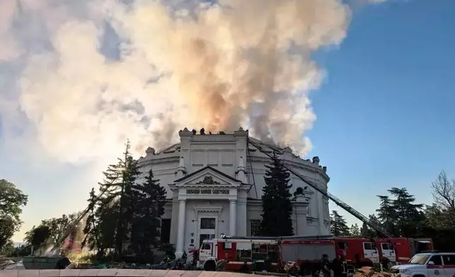 FILE - In this photo provided by Sevastopol Mayor Mikhail Razvozhaev's Telegram channel on Wednesday, June 10, 2026, firefighters put out a blaze after a Ukrainian drone hit a building housing a panoramic painting that depicts the defense of the city during the 19th century Crimean War in Sevastopol, Crimea. (Sevastopol Mayor Mikhail Razvozhaev's Telegram channel via AP, File)