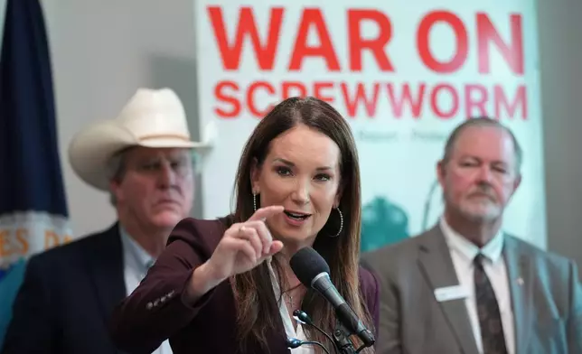U.S. Agriculture Secretary Brooke Rollins, center, holds a news conference with ranchers, researchers and officials at the Knipling-Bushland U.S. Livestock Insects Research Laboratory in Kerrville, Texas, Monday, June 8, 2026. (AP Photo/Eric Gay)