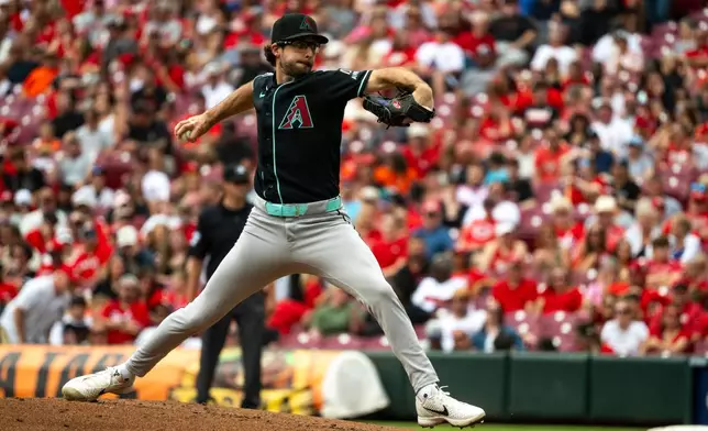 Arizona Diamondbacks pitcher Zac Gallen delivers in the first inning of a baseball game against the Cincinnati Reds, Sunday, June 14, 2026, in Cincinnati. (AP Photo/Michael Swensen)
