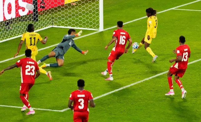 Ghana's Caleb Yirenkyi, top right, scores the opening goal on Panama goalkeeper Orlando Mosquera (22) during the World Cup Group L soccer match between Ghana and Panama in Toronto, Wednesday, June 17, 2026. (Chris Young/The Canadian Press via AP)
