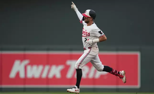 Minnesota Twins' Kody Clemens (2) runs the bases after hitting a solo home run during the third inning of a baseball game against the Kansas City Royals, Thursday, June 4, 2026, in Minneapolis. (AP Photo/Abbie Parr)