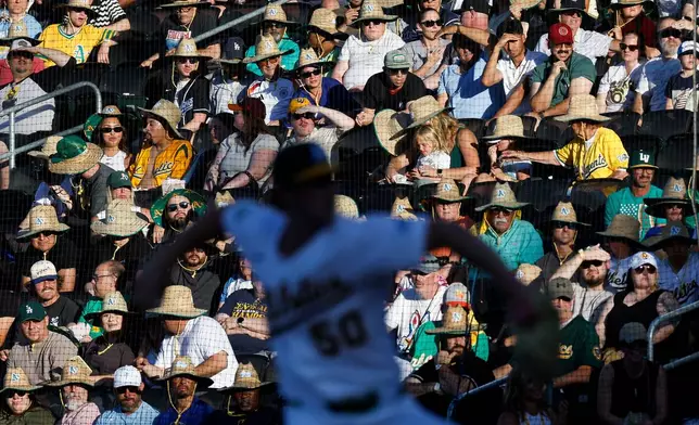 Athletics starting pitcher Jack Perkins (50) throws during the third inning of a baseball game against the Milwaukee Brewers, Wednesday, June 10, 2026, in Las Vegas. (AP Photo/Caroline Brehman)