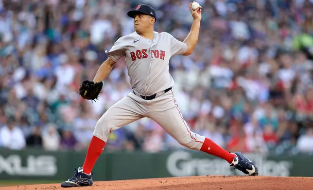 Boston Red Sox starting pitcher Ranger Suarez throws against the Seattle Mariners during the first inning of during a baseball game, Friday, June 19, 2026, in Seattle. (AP Photo/John Froschauer)
