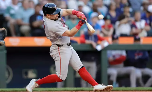 Boston Red Sox's Caleb Durbin hits a solo home run off Seattle Mariners starting pitcher Bryce Miller during the second inning of a baseball game, Friday, June 19, 2026, in Seattle. (AP Photo/John Froschauer)