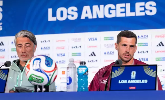 Switzerland's Remo Freuler, right, speaks next to head coach Murat Yakin during a press conference one day ahead of the World Cup Group B soccer match between Switzerland and Bosnia Herzegovina in Inglewood, Calif., near Los Angeles, Wednesday, June 17, 2026. (Peter Klaunzer/Keystone via AP)