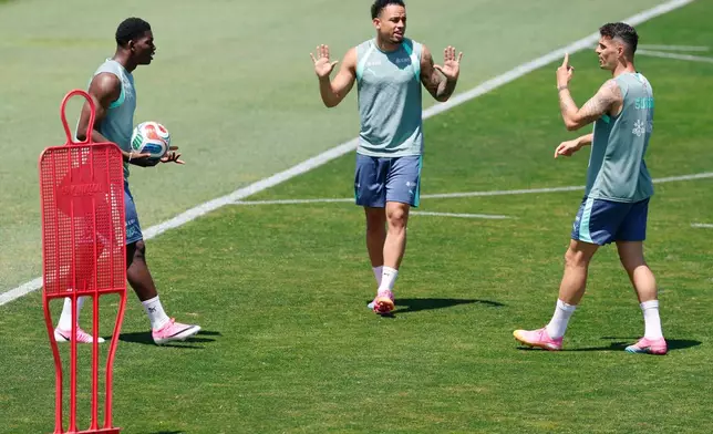 Switzerland's, from left, Breel Embolo, Noah Okafor and Granit Xhaka argue during a training session for the national soccer team, Tuesday, June 9, 2026, in San Diego, ahead of the World Cup soccer tournament. (Peter Klaunzer/Keystone via AP)