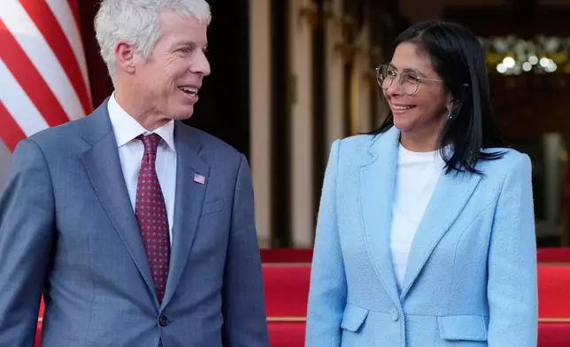 FILE - Venezuela's acting President Delcy Rodriguez bids farewell to U.S. Energy Secretary Chris Wright after their meeting at Miraflores Palace in Caracas, Venezuela, on Feb. 11, 2026. (AP Photo/Ariana Cubillos, File)