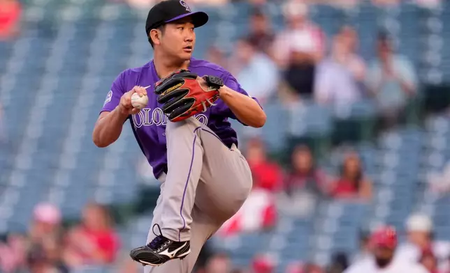 Colorado Rockies pitcher Tomoyuki Sugano throws to the plate during the first inning of a baseball game against the Los Angeles Angels, Tuesday, June 2, 2026, in Anaheim, Calif. (AP Photo/Mark J. Terrill)