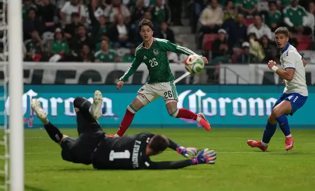 Mexico's Brian Gutierrez (26) attempts a shot on goal against Serbia during an international friendly soccer match in Toluca, Mexico, Thursday, June 4, 2026. (AP Photo/Fernando Llano)
