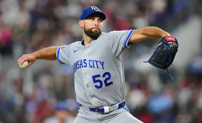 Kansas City Royals starting pitcher Michael Wacha throws to the Texas Rangers during the third inning of a baseball game Sunday, May 31, 2026, in Arlington. (AP Photo/Julio Cortez)