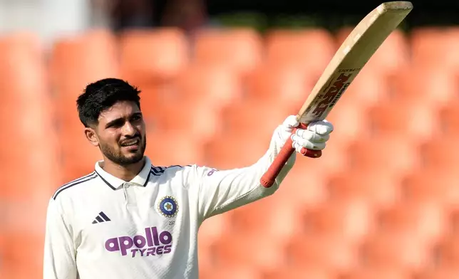 India's captain Shubman Gill celebrates his century on day one of the cricket test match between Afghanistan and India in New Chandigarh, India, Saturday, June 6, 2026. (AP Photo/Ashwini Bhatia)
