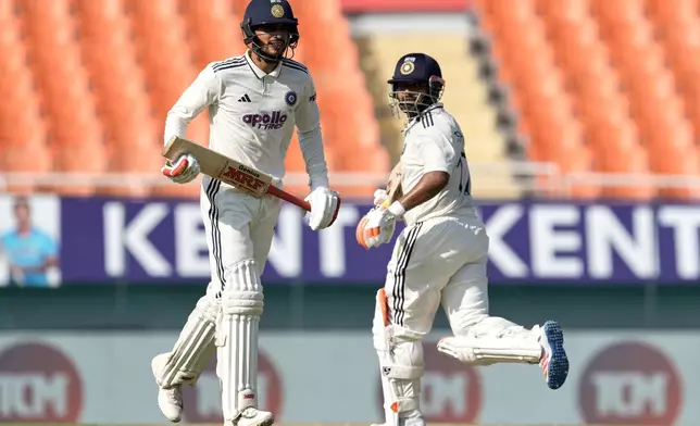 India's captain Shubman Gill, left, and batting partner Rishabh Pant run between the wickets on day one of the cricket test match between Afghanistan and India in New Chandigarh, India, Saturday, June 6, 2026. (AP Photo/Ashwini Bhatia)
