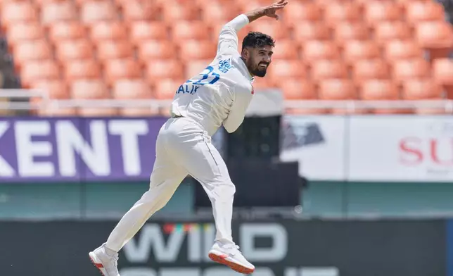 Afghanistan's Abdul Malik bowls a delivery on day one of the cricket test match between Afghanistan and India in New Chandigarh, India, Saturday, June 6, 2026. (AP Photo/Ashwini Bhatia)