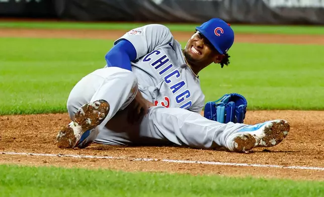Chicago Cubs' pitcher Edward Cabrera (30) reacts after an injury during the fifth inning of a baseball game against the New York Mets , Tuesday, June 23, 2026, in New York. (AP Photo/Noah K. Murray)