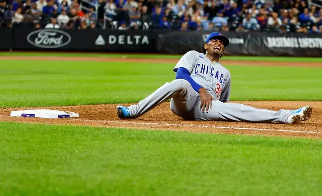 Chicago Cubs' pitcher Edward Cabrera (30) reacts after an injury during the fifth inning of a baseball game against the New York Mets , Tuesday, June 23, 2026, in New York. (AP Photo/Noah K. Murray)